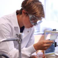 Student testing out an experiment